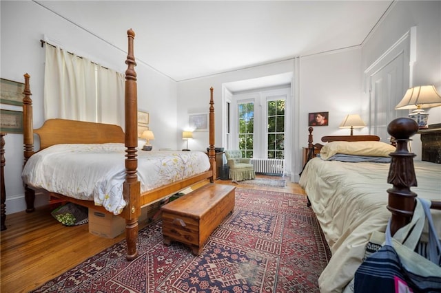33 Kay St, Newport, RI 02840 - bedroom with radiator heating unit, wood finished floors, and ornamental molding