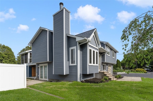 151 Mohawk Trl, Cranston, RI 02921 - view of home's exterior featuring a chimney, french doors, and entry steps