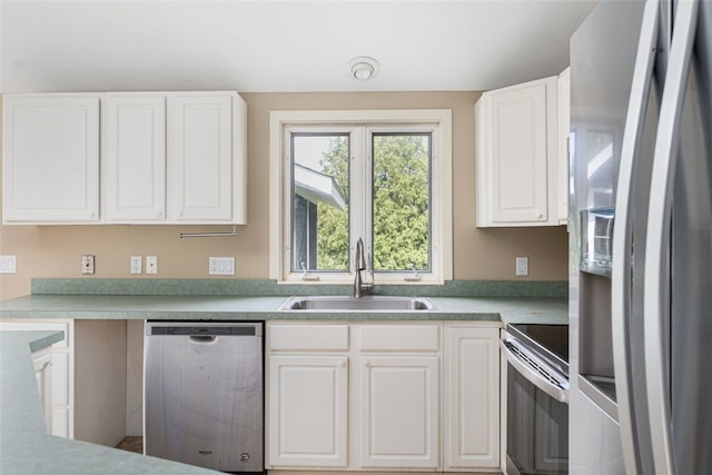 151 Mohawk Trl, Cranston, RI 02921 - kitchen featuring stainless steel appliances, white cabinetry, and light countertops