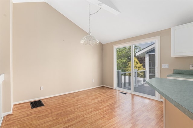 151 Mohawk Trl, Cranston, RI 02921 - unfurnished dining area with light wood-style flooring and high vaulted ceiling