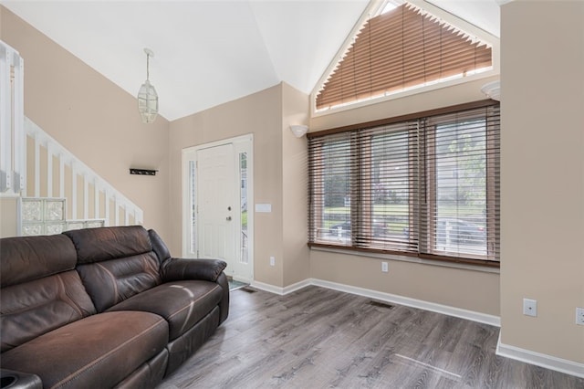 151 Mohawk Trl, Cranston, RI 02921 - living area with high vaulted ceiling and wood finished floors