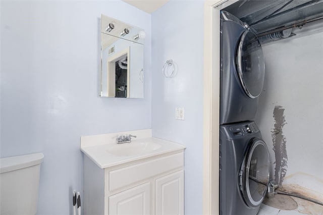 151 Mohawk Trl, Cranston, RI 02921 - laundry area featuring stacked washing machine and dryer