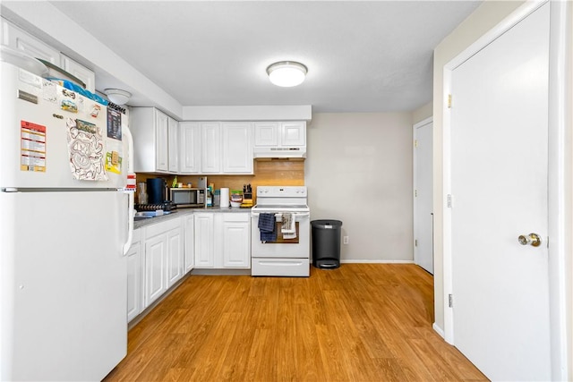 40 Agnes St, East Providence, RI 02914 - kitchen with white appliances, under cabinet range hood, light wood-type flooring, white cabinetry, and light countertops