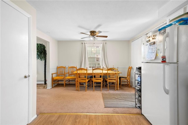 40 Agnes St, East Providence, RI 02914 - dining space with a ceiling fan, a baseboard heating unit, and light wood-type flooring
