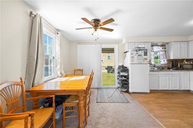 40 Agnes St, East Providence, RI 02914 - dining area with a ceiling fan and light wood-style flooring