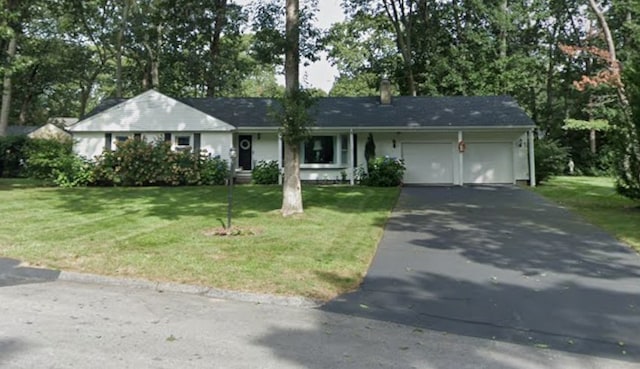 407 Red Chimney Dr, Warwick, RI 02886 - single story home with driveway, a front yard, and an attached garage