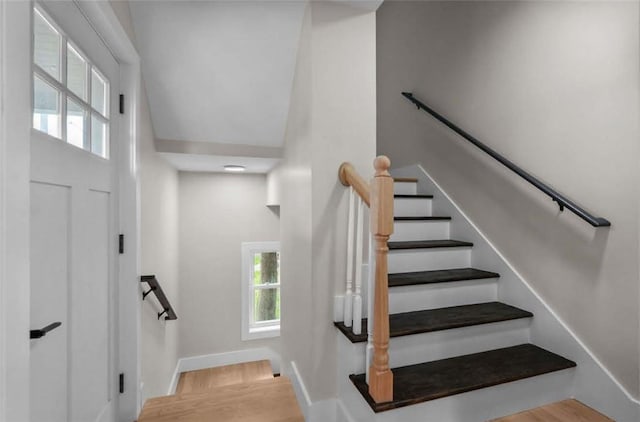 129 Stanwood St, Providence, RI 02907 - staircase with healthy amount of natural light, wood finished floors, and a high ceiling