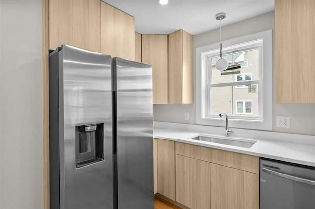 129 Stanwood St, Providence, RI 02907 - kitchen with appliances with stainless steel finishes, light brown cabinets, and light countertops