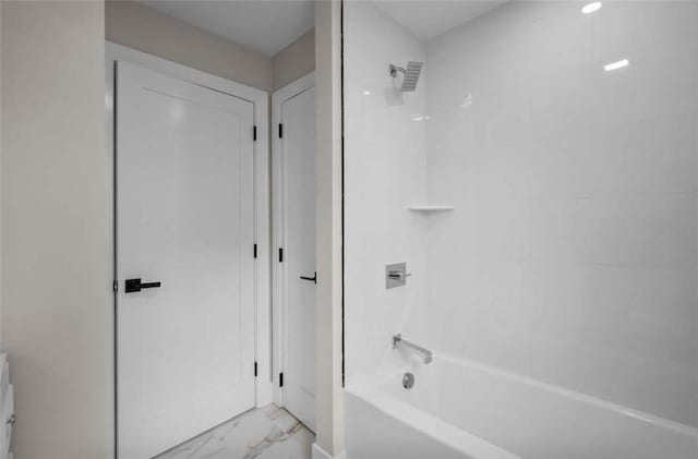 129 Stanwood St, Providence, RI 02907 - bathroom with marble look tiles and shower / bathtub combination