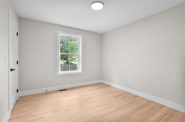 129 Stanwood St, Providence, RI 02907 - empty room with light wood finished floors and baseboards