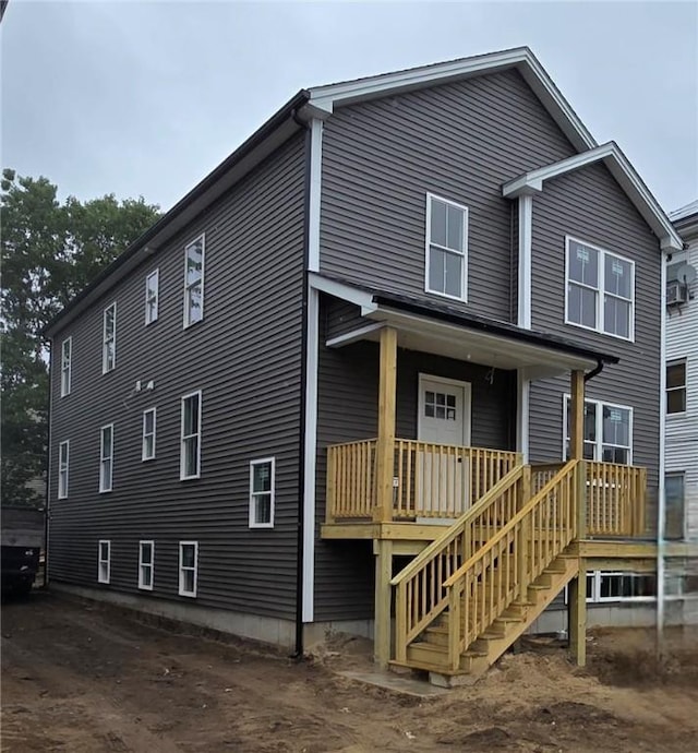 129 Stanwood St, Providence, RI 02907 - view of front of home featuring stairway and covered porch