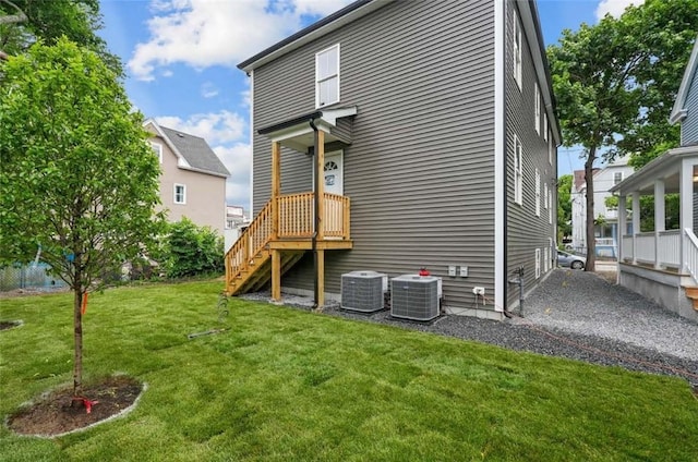 129 Stanwood St, Providence, RI 02907 - rear view of property featuring a yard