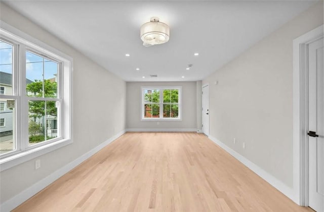129 Stanwood St, Providence, RI 02907 - empty room with light wood-type flooring and recessed lighting