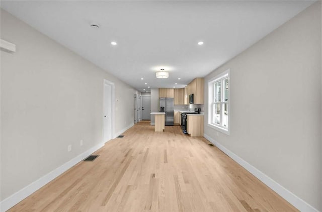 129 Stanwood St, Providence, RI 02907 - unfurnished living room with light wood-style floors and recessed lighting