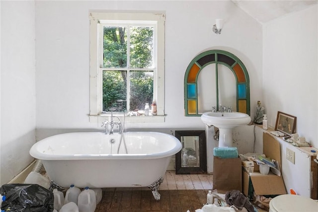 52 Spring St, South Kingstown, RI 02879 - bathroom featuring hardwood / wood-style flooring and a soaking tub
