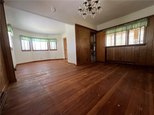16 Winthrop St, Cranston, RI 02910 - empty room featuring hardwood / wood-style flooring, a chandelier, and a smoke detector