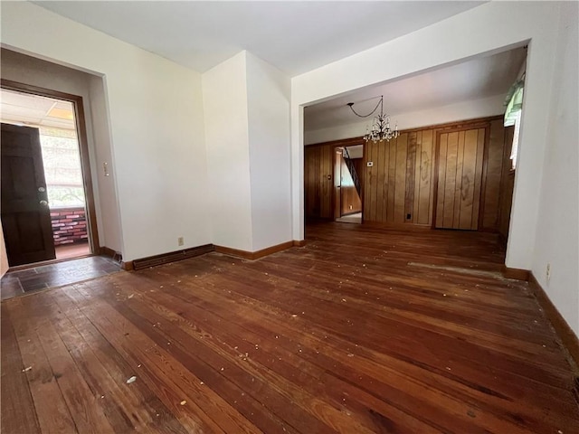 16 Winthrop St, Cranston, RI 02910 - unfurnished dining area with dark wood-style floors and a chandelier