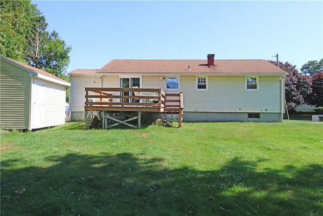 27 Louise Dr, Tiverton, RI 02878 - back of property with a wooden deck and a lawn