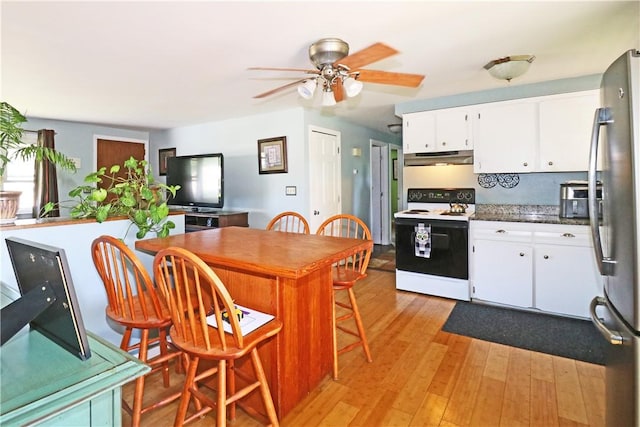 27 Louise Dr, Tiverton, RI 02878 - kitchen featuring white range with electric cooktop, freestanding refrigerator, under cabinet range hood, white cabinets, and light wood finished floors