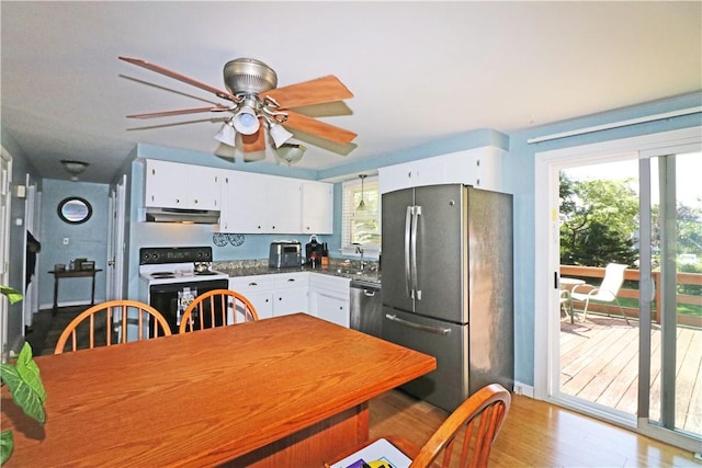 27 Louise Dr, Tiverton, RI 02878 - kitchen with appliances with stainless steel finishes, under cabinet range hood, white cabinets, a ceiling fan, and light wood finished floors