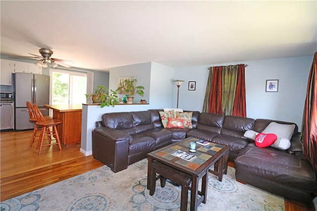 27 Louise Dr, Tiverton, RI 02878 - living room with light wood-style flooring and ceiling fan