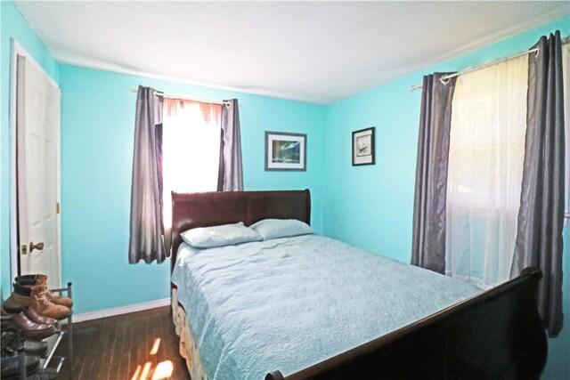 27 Louise Dr, Tiverton, RI 02878 - bedroom featuring dark wood-style floors and baseboards