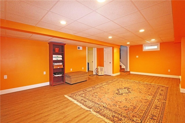 27 Louise Dr, Tiverton, RI 02878 - basement with wood finished floors, stairs, recessed lighting, and a paneled ceiling