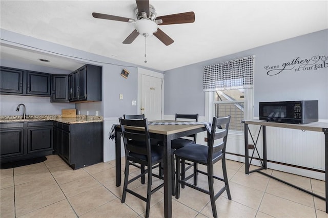 40 W Cole St, Pawtucket, RI 02861 - dining space with light tile patterned floors, ceiling fan, and a baseboard heating unit