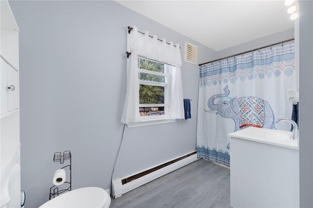 40 W Cole St, Pawtucket, RI 02861 - bathroom with baseboard heating, vanity, wood finished floors, and curtained shower