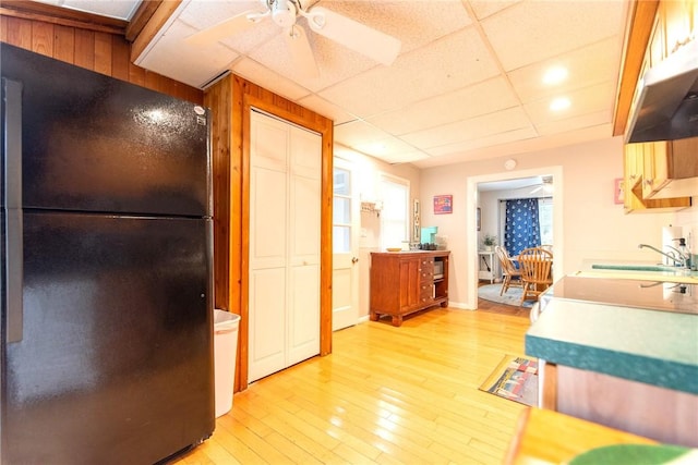 130 Knowlesway Ext, Narragansett, RI 02882 - kitchen with freestanding refrigerator, a ceiling fan, light wood-style flooring, and under cabinet range hood