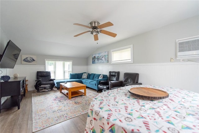 130 Knowlesway Ext, Narragansett, RI 02882 - living room featuring ceiling fan, a wainscoted wall, wood finished floors, a wall mounted AC, and lofted ceiling