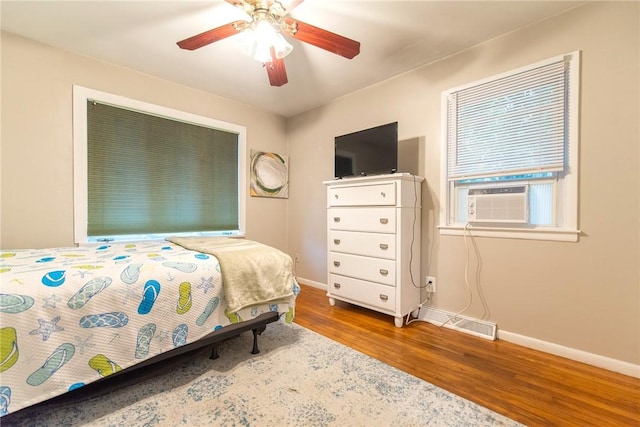 130 Knowlesway Ext, Narragansett, RI 02882 - bedroom featuring wood finished floors, ceiling fan, and cooling unit