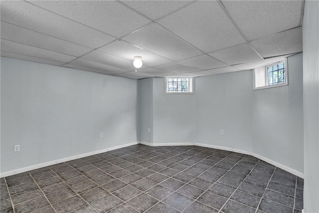 199 Linwood Ave, Providence, RI 02907 - basement featuring a paneled ceiling and dark tile patterned floors