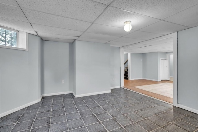 199 Linwood Ave, Providence, RI 02907 - below grade area featuring dark tile patterned flooring, a paneled ceiling, and stairway