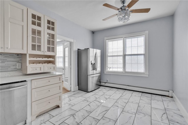 199 Linwood Ave, Providence, RI 02907 - kitchen with appliances with stainless steel finishes, a baseboard radiator, light marble finish floors, light countertops, and a ceiling fan