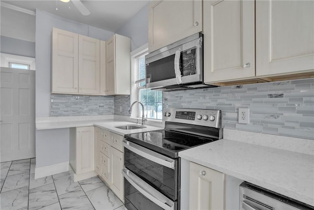 199 Linwood Ave, Providence, RI 02907 - kitchen featuring appliances with stainless steel finishes, light marble finish floors, plenty of natural light, and backsplash
