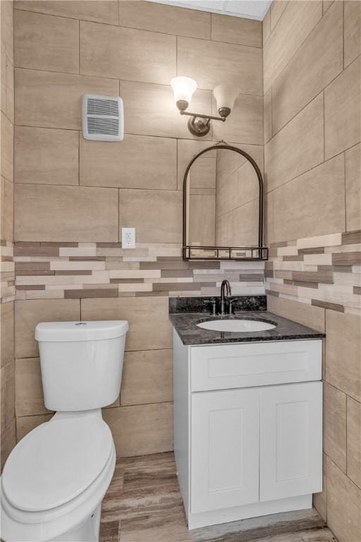 199 Linwood Ave, Providence, RI 02907 - half bath with tile walls, vanity, and wood finished floors