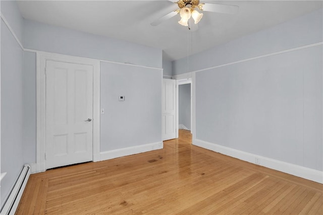 199 Linwood Ave, Providence, RI 02907 - unfurnished bedroom with baseboard heating, light wood-type flooring, and a ceiling fan