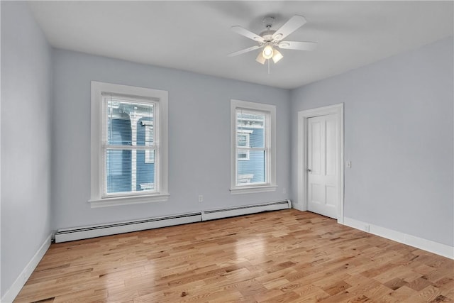199 Linwood Ave, Providence, RI 02907 - unfurnished room featuring a baseboard heating unit, light wood-type flooring, and a ceiling fan