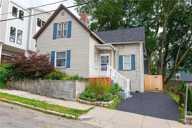9 Locust St, Providence, RI 02906 - traditional-style home featuring a chimney and a shingled roof