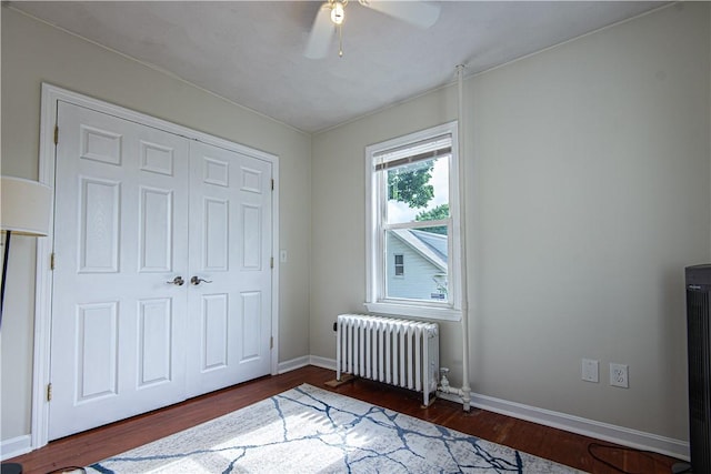 9 Locust St, Providence, RI 02906 - bedroom with radiator heating unit, wood finished floors, a closet, and a ceiling fan