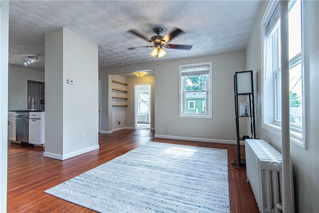 9 Locust St, Providence, RI 02906 - entryway with radiator, ceiling fan, and dark wood-style floors