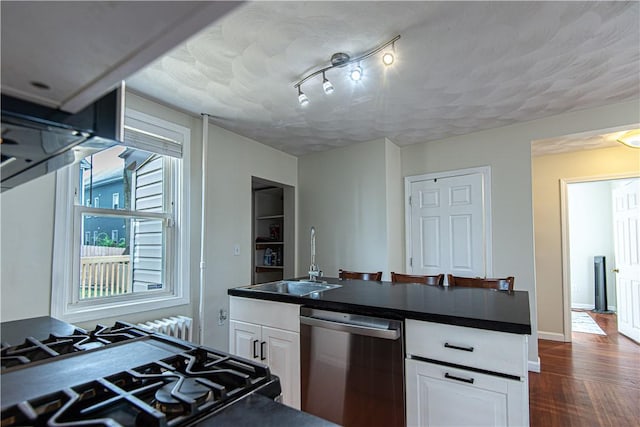 9 Locust St, Providence, RI 02906 - kitchen featuring dishwasher, dark countertops, white cabinets, and dark wood finished floors