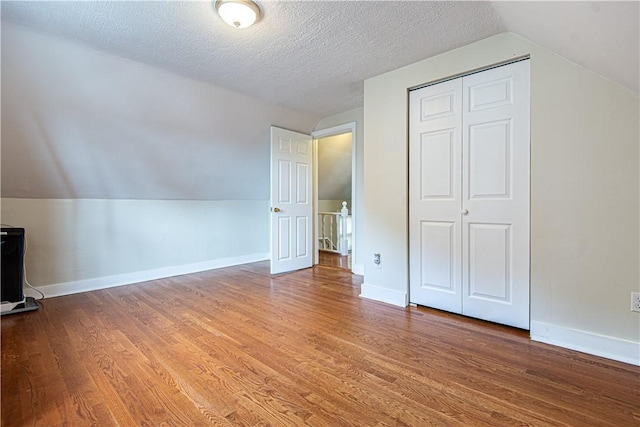 9 Locust St, Providence, RI 02906 - bonus room with vaulted ceiling, wood finished floors, and a textured ceiling
