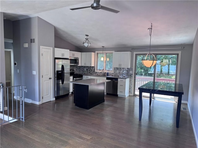27 Brook St, West Warwick, RI 02893 - kitchen featuring stainless steel appliances, backsplash, white cabinets, ceiling fan, and dark wood finished floors
