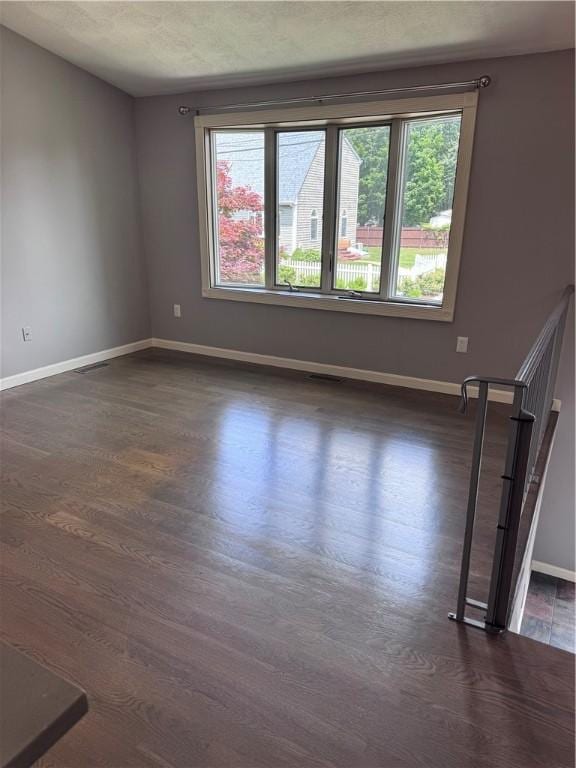 27 Brook St, West Warwick, RI 02893 - unfurnished room with healthy amount of natural light and dark wood-style flooring