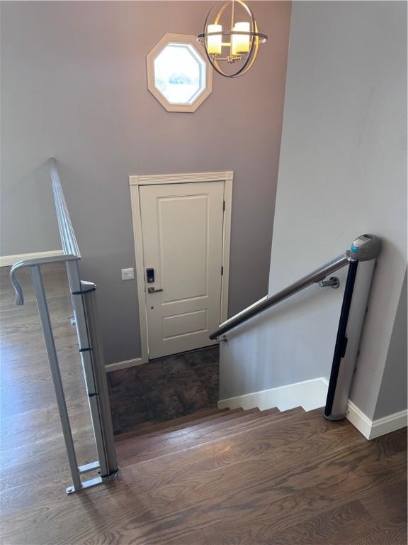 27 Brook St, West Warwick, RI 02893 - entryway featuring a chandelier and wood finished floors