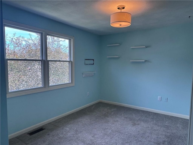 27 Brook St, West Warwick, RI 02893 - carpeted empty room with baseboards