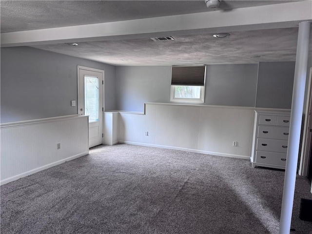 27 Brook St, West Warwick, RI 02893 - spare room with wainscoting, carpet, and a textured ceiling