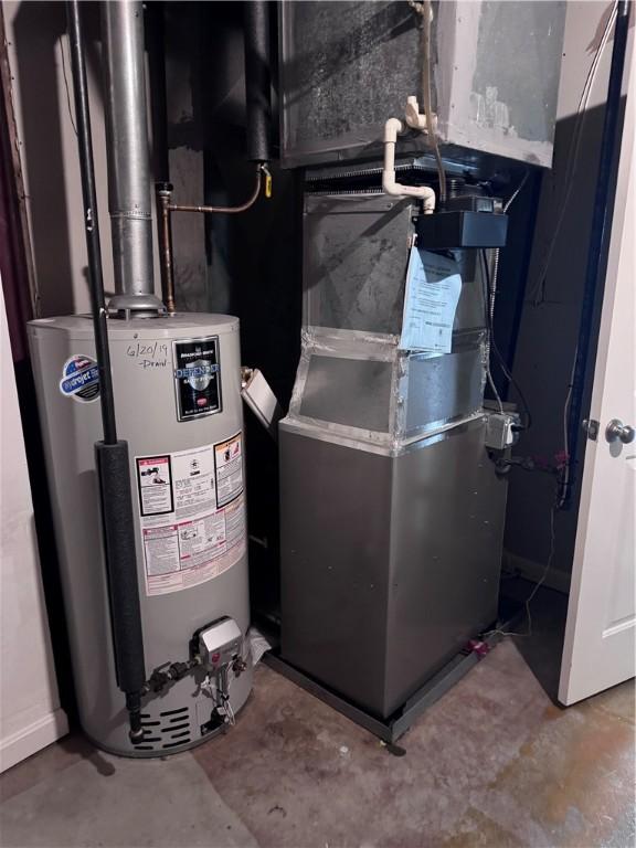 27 Brook St, West Warwick, RI 02893 - utility room featuring water heater and heating unit